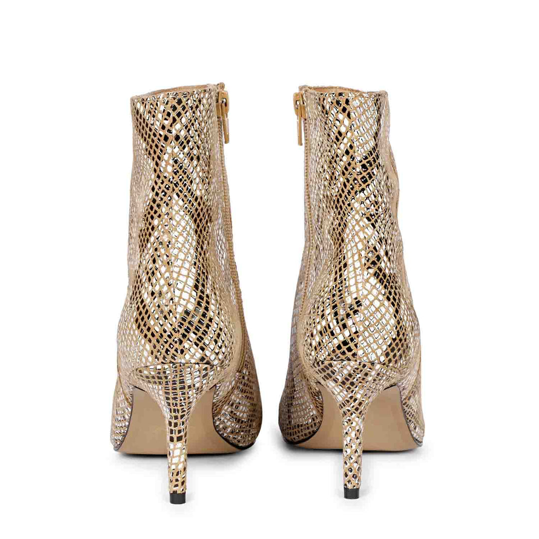Trendy snake print ankle boots with kitten heels by Saint Lottie.