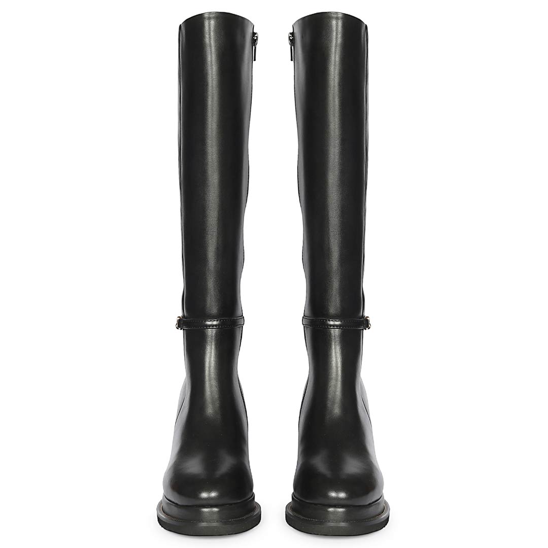 A pair of black leather knee-high boots with side zippers and a decorative strap detail near the ankle
