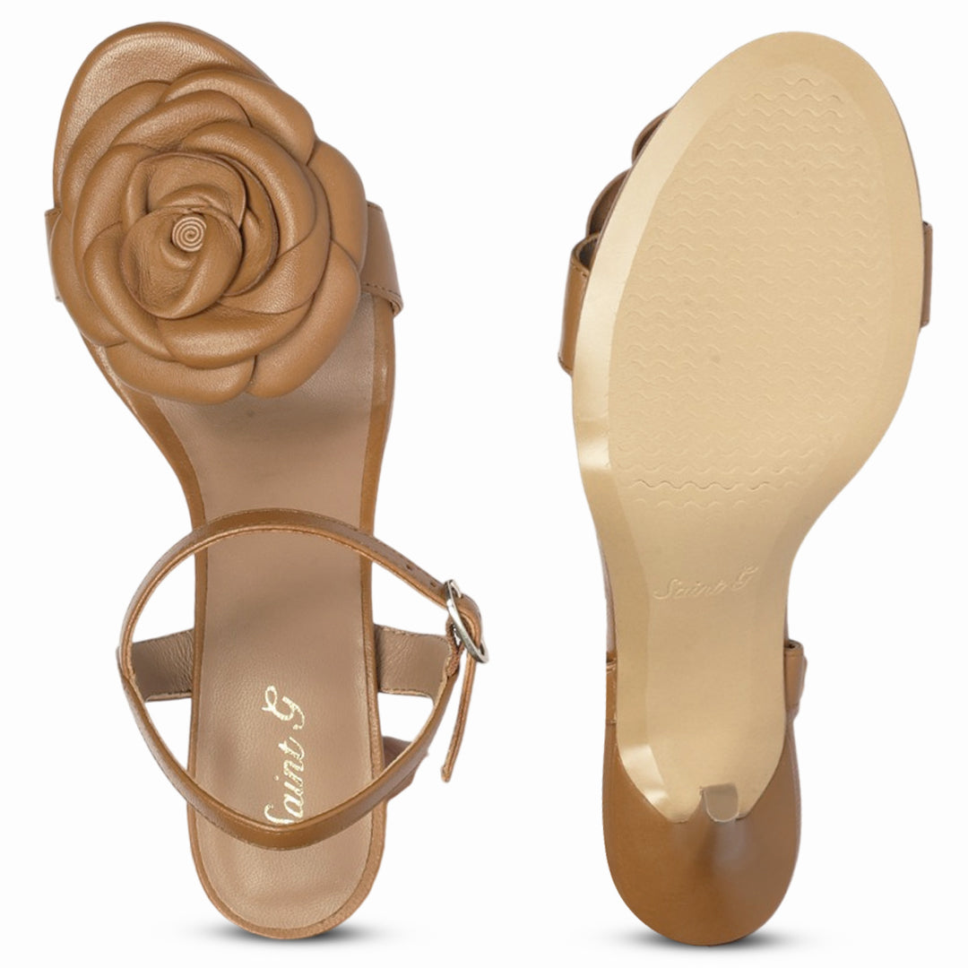A pair of women's flat sandals in tan leather