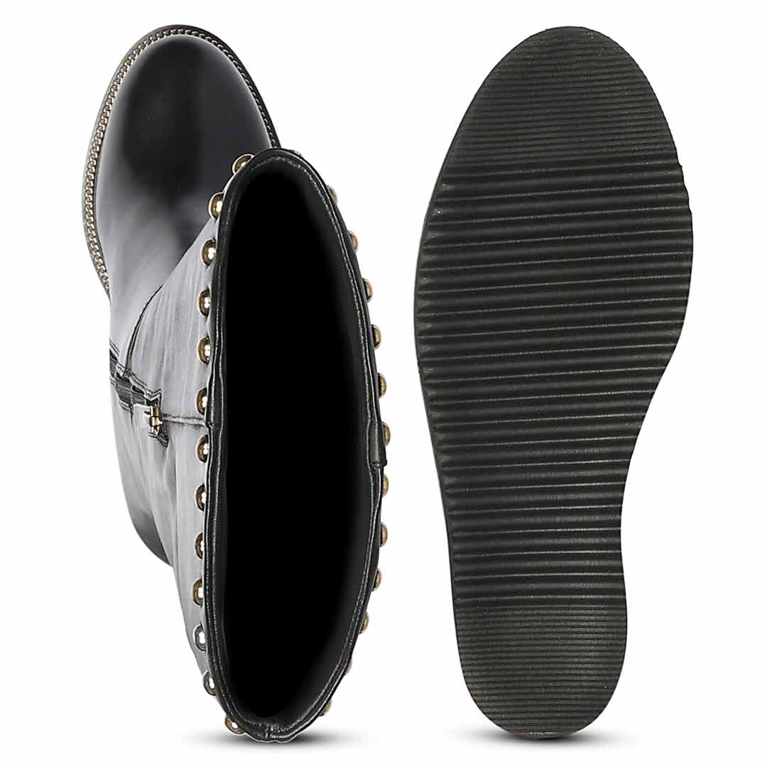 A pair of black mid-calf boots shown on a white background, with one boot displaying the side and open top decorated with metallic studs
