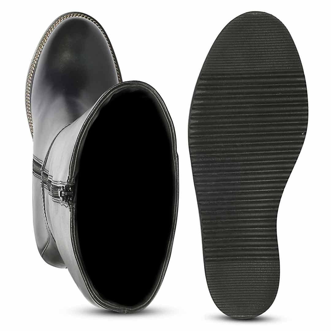 A pair of black rain boots shown display the side zipper and the other lying flat to show the textured treaded sole.