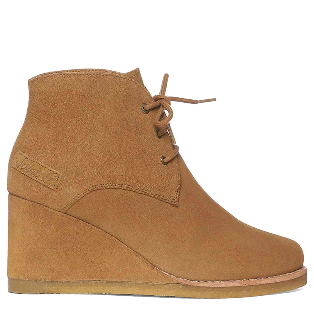 Chic and cozy Saint Tesorina Tan Suede Wedge Boots, perfect for elevated style and all-day comfort. Lace-up in fashion-forward footwear