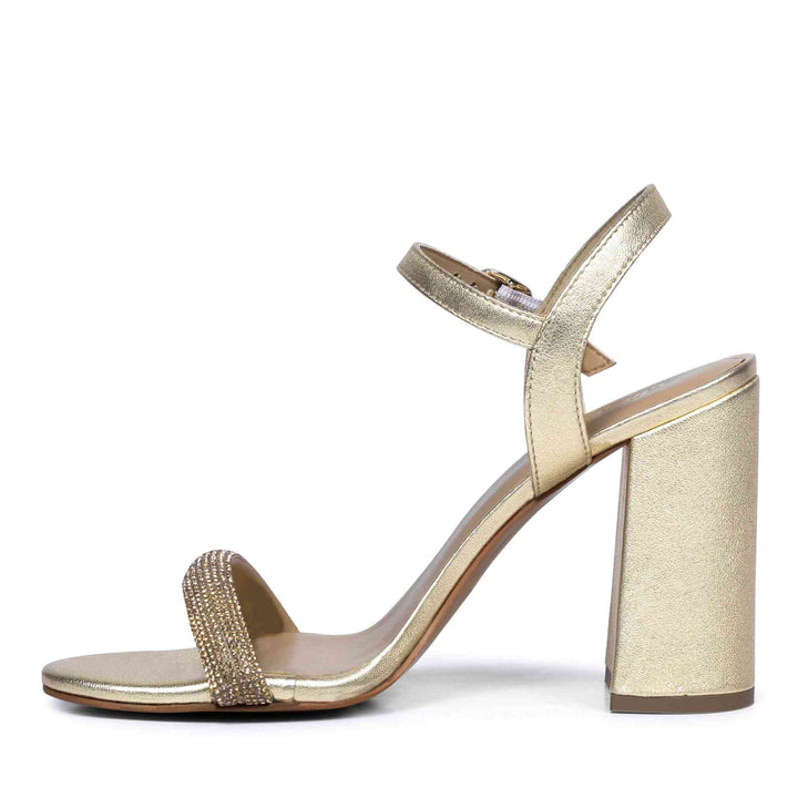 Metallic gold leather block heels by Saint Gracie featuring sparkling strass embellishments.