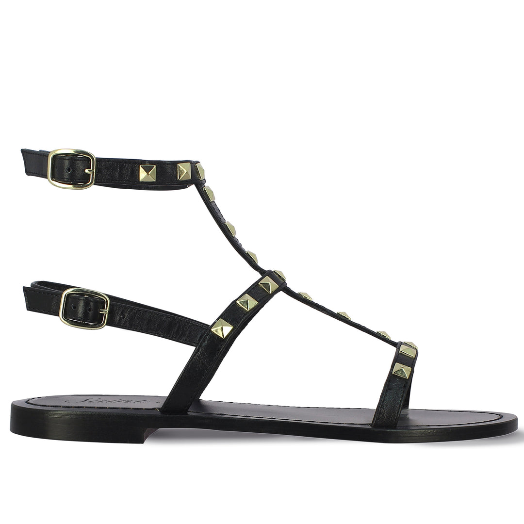 Saint Miriam Black Leather Flat Sandals: Chic, comfortable flats in timeless black leather. Perfect for any occasion.