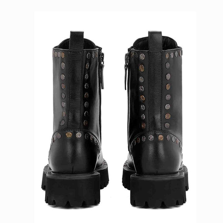 Sleek and edgy SAINT NATALIE boots with metal studs, lace-up design, and high ankle for a stylish look