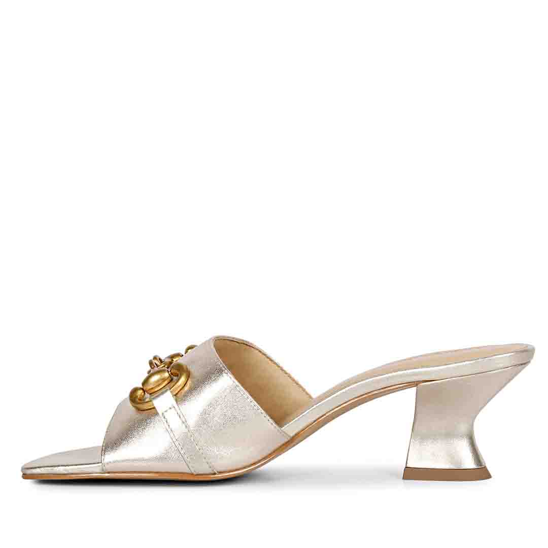 Sleek elegance: Saint Bianca Platin Leather Mid Heels with Gold Horsebit detailing, sculpted for timeless style.