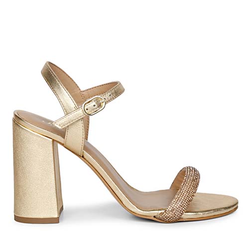 Metallic gold leather block heels by Saint Gracie featuring sparkling strass embellishments