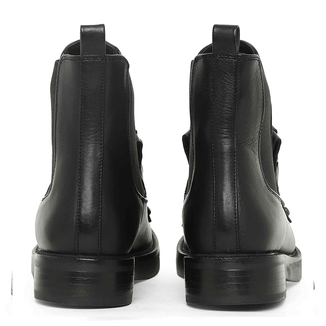 Saint Madelyn Zip-Up Heel Boots - Walk in style with these black leather boots featuring a front zipper for easy wear. The pointed toe and chic design make them a must-have for any fashion-forward individual.