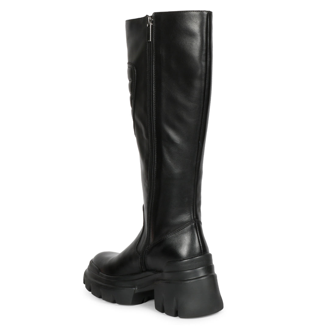 Saint Eloise black knee high boots, angled back view of lug sole