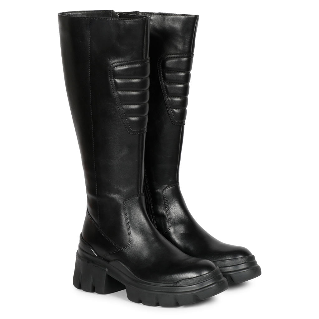 Black leather knee high boots for women UK, pair view showing lug sole and quilted panel