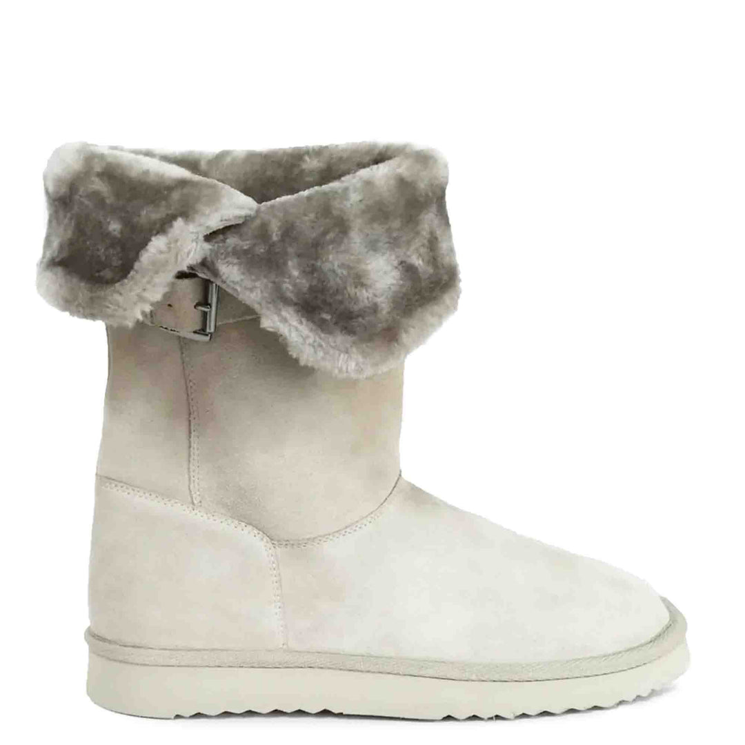Chic ivory suede boots with decorative buckle, crafted by Saint Aurelia for snug comfort and style