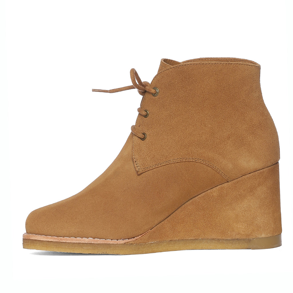 Chic and cozy Saint Tesorina Tan Suede Wedge Boots, perfect for elevated style and all-day comfort. Lace-up in fashion-forward footwear